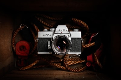 Brown rope black-and-white SLR cameras
